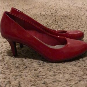 Red patent leather pumps